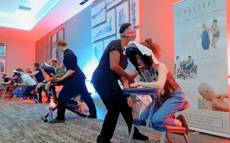 Offering mobile event wellbeing service of event massage London at staff Christmas party.